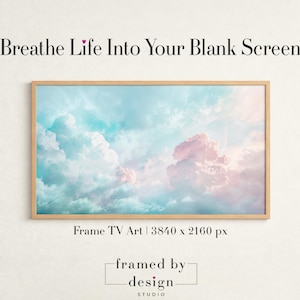 May include: A framed digital art print featuring a serene sky with fluffy pink and blue clouds. The artwork is rectangular with a light wood frame. Text at the top reads "Breathe Life Into Your Blank Screen". The bottom text says "Frame TV Art | 3840 x 2160 px" and "framed by design studio".