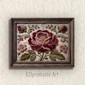 May include: A framed floral artwork featuring a large, textured rose in shades of burgundy and pink, surrounded by smaller flowers and green leaves. The artwork is set against a light background and framed in a dark wood.