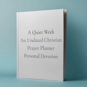 May include: A white book titled "A Quiet Week" with the subtitle "An Undated Christian Prayer Planner Personal Devotion" is displayed against a teal background. The book's cover is clean and simple, with text in a serif font.
