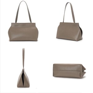 May include: A taupe-colored handbag with a rectangular base and curved sides. The bag has a single handle and is shown from multiple angles, including a front view, side view, and a view of the bottom.