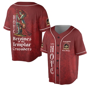 May include: Burgundy baseball jersey with white trim and button-up front. The back features a knight illustration and text: "Heroines of the Templar Crusaders." The front has the text "HOTC" and "Eureka Guild No. 1, Detroit, Michigan."
