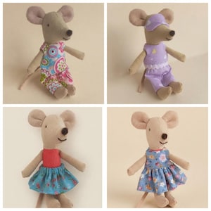 May include: Four plush mouse dolls made of tan fabric with embroidered facial features. One wears a floral romper, one a purple outfit with a sleep mask, one a red top with a blue floral skirt, and one a blue floral dress with a red collar.
