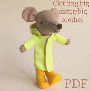 May include: A plush mouse toy wearing a bright yellow hooded raincoat and yellow rain boots with white polka dots. The text "Clothing big sister/big brother" and "PDF" are visible in the image. The mouse has light brown fur and a dark nose.