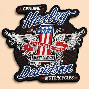 May include: A black Harley-Davidson patch with white, red, and blue embroidered details. The patch features the words "Genuine Harley-Davidson Motorcycles" and the number "1" with stars and stripes, and wings.