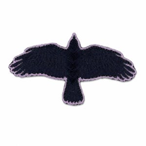 May include: A black crow patch with outstretched wings, outlined in a light purple color. The patch is designed to be sewn onto fabric, and is suitable for jackets, bags, or other apparel.