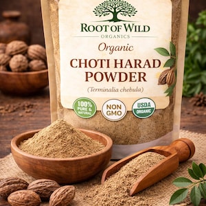 May include: A package of "Root of Wild Organics" Choti Harad Powder, with a wooden bowl and scoop filled with the brown powder. The package has "Organic" and "USDA Organic" labels. The image also shows whole nuts.