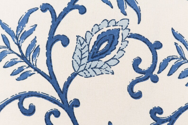 May include: Blue and white floral fabric with a paisley design. The fabric features a repeating pattern of leaves and flowers.