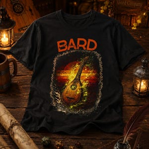 May include: Black t-shirt with the word "BARD" in orange block letters. The shirt features a graphic of a lute with musical notes against a sunset background. The design is framed by a textured border.