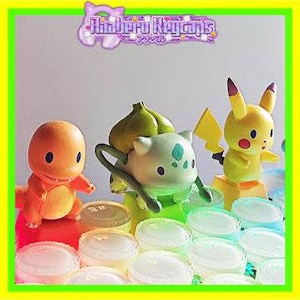 May include: A collection of colorful, character-themed keycaps featuring a Charmander, Bulbasaur, and Pikachu. The keycaps are displayed on a keyboard, with the brand name "Ahiberu Keycaps" visible in the image.