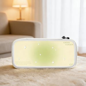 May include: A set of three ceramic canisters with lids, featuring a geometric pattern in shades of blue, white, and gray. The canisters vary in size, with the largest approximately 8 inches tall.