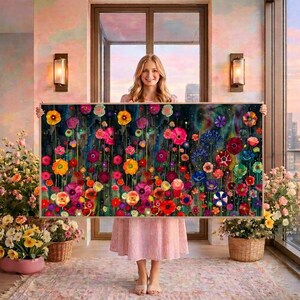 May include: A large rectangular wall art piece featuring a vibrant, dense field of colorful flowers against a dark, moody background. The painting displays a variety of blossoms in shades of red, pink, orange, yellow, blue, and purple, with thin green stems.
