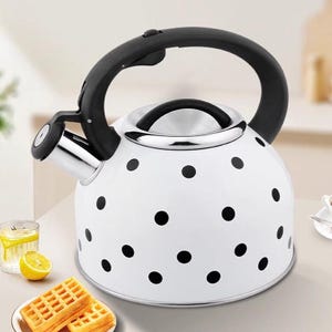 May include: A white ceramic mug with a black handle and the text "But First, Coffee" in a black, bold font. The mug is sitting on a wooden surface. The mug is approximately 4 inches tall.