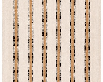 May include: Cream-colored rug with vertical stripes. The rug features alternating stripes of tan and black. The tan stripes are wider and have a textured appearance, while the black stripes are thinner and dotted. The rug is made of a woven material.