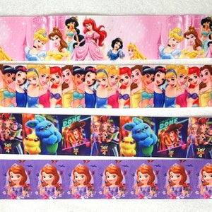 May include: Four different ribbon designs featuring Disney characters. The first ribbon is pink with princesses like Cinderella, Ariel, and Belle. The second ribbon is white with princesses like Snow White, Cinderella, and Aurora. The third ribbon is blue with characters from Toy Story 4, including Woody, Buzz Lightyear, and Forky. The fourth ribbon is purple with Princess Sofia the First.