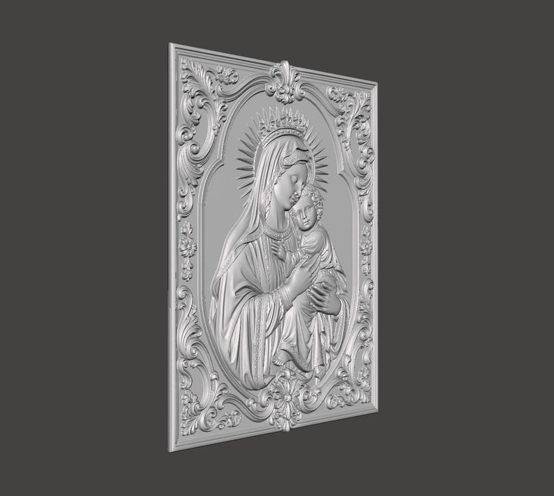 May include: A silver-toned rectangular wall plaque featuring a three-dimensional relief of a figure holding a child. The central oval panel is surrounded by an ornate, scrolling border with floral motifs. The figures wear crowns and halos.