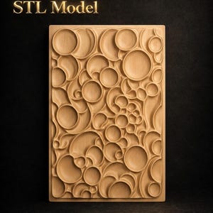 May include: A rectangular wooden panel with a carved design of overlapping circles and curved shapes. The panel is light brown and has a three-dimensional effect. The text "STL Model" is in gold lettering at the top.