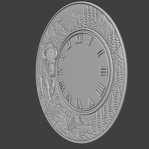 May include: A grey, circular wall clock with a detailed relief design. The clock face features Roman numerals and is surrounded by a border with a bison, mountains, and trees. The clock has a diameter of approximately 30 cm.