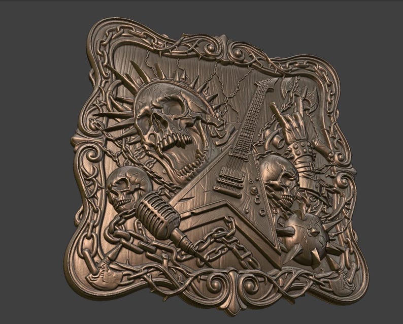 May include: A bronze-colored relief sculpture featuring a skull, electric guitar, microphone, and a hand making a rock and roll gesture. The design includes chains, spikes, and decorative flourishes, creating a heavy metal theme.