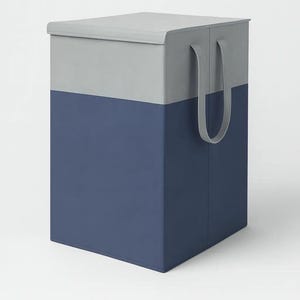 May include: A two-tone storage bin with a grey top and navy blue bottom. The bin has two grey handles and a matching lid. The rectangular bin is made of a sturdy material, suitable for organising items.