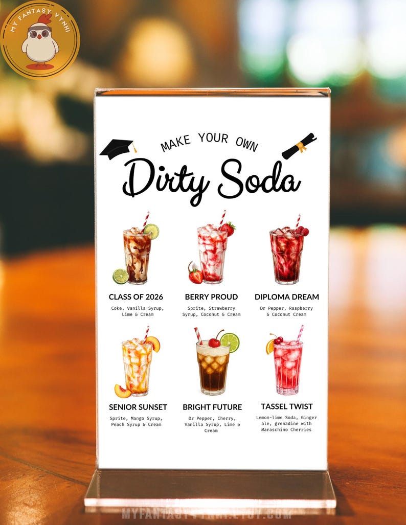 May include: A clear acrylic sign displays six colorful soda recipes with names like "Class of 2026" and "Berry Proud." The sign reads "Make Your Own Dirty Soda" in a stylish font. Each drink is garnished with fruit and served in a tall glass.
