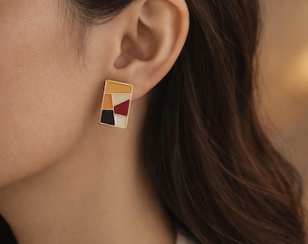 Oorknopjes met geometrische kleurblokken: moderne, minimalistische sieraden van legeringen