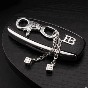 May include: A white ceramic mug with a black handle and the text "But First, Coffee" in a handwritten style. The mug is on a white surface. The mug is approximately 4 inches tall.