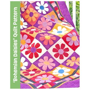 May include: A quilt featuring a repeating diamond pattern with colorful fabric daisies in shades of purple, orange, red, pink, and white. The text 'Bohemian Daisies' Quilt Pattern' is printed vertically on a green bar on the left side.