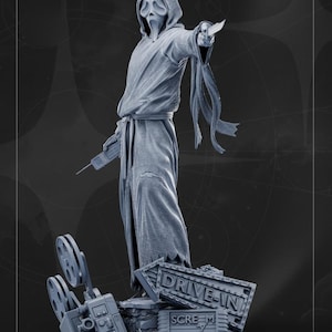 May include: A gray statue of the Ghostface killer from the Scream movie franchise. The figure is wearing a hooded robe and holding a knife and a remote. A sign that says "Drive-In Scream" is at the base.