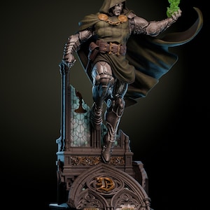 May include: A detailed statue of a character in a green hooded cloak and silver armor, holding a green energy effect. The figure stands atop a gothic-style base with intricate architectural details. The statue has a dynamic pose.