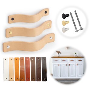 May include: A collection of leather cabinet pulls in various colors and styles. The image shows three light tan wavy leather pulls with different colored rivets, along with a selection of colored leather pulls and cabinet knobs. A white cabinet with leather pulls is also shown.