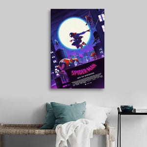 May include: A framed canvas print featuring the animated film "Spider-Man: Into the Spider-Verse." The artwork depicts Spider-Man in action against a cityscape backdrop, with a large moon in the sky. The title is prominently displayed in pink.