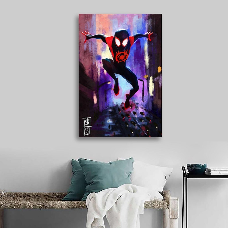 May include: A canvas print featuring a dynamic illustration of a superhero in a black and red suit, leaping through a city street. The artwork uses a vibrant color palette of purples, blues, and reds, with a stylized, painterly effect. The superhero's emblem is visible on the chest.