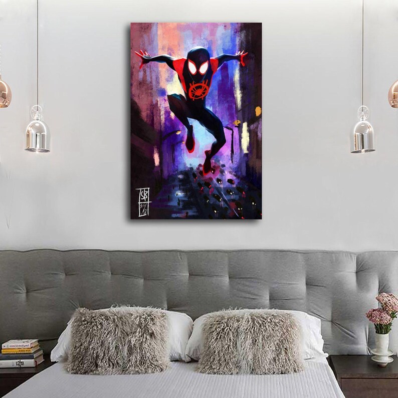 May include: A canvas print of a superhero in a dynamic pose, set against a vibrant cityscape. The figure, clad in a black and red suit, is mid-air with arms outstretched. The artwork features a colorful, impressionistic style with a signature in the lower left corner.