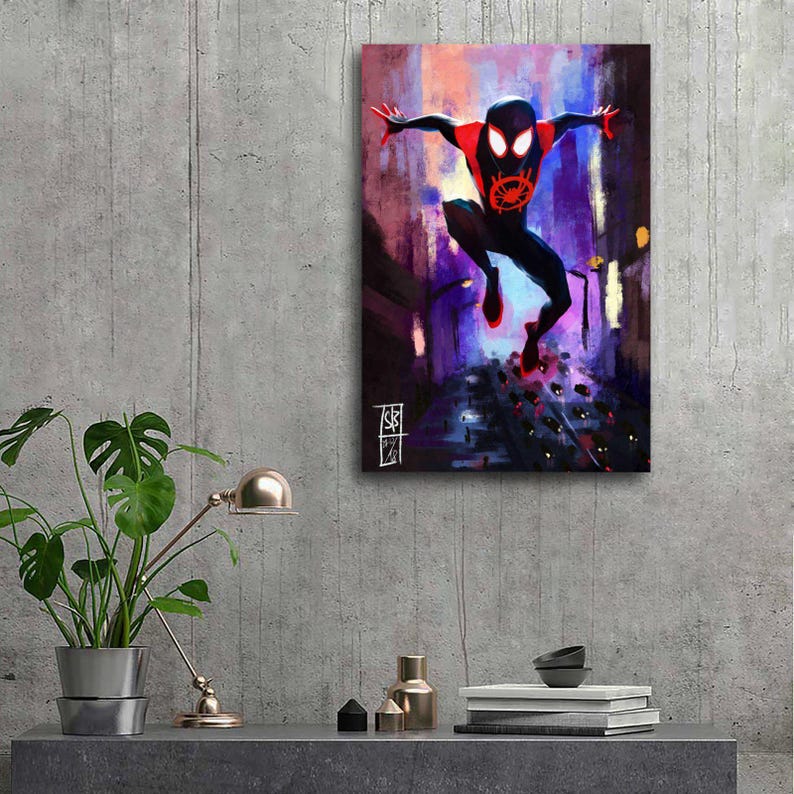 May include: A canvas print of a superhero in a dynamic pose, set against a vibrant cityscape. The character is clad in a black suit with red accents, including the mask and feet. The background features a blend of purple, orange, and blue hues, suggesting a nighttime setting.