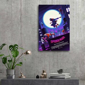 May include: A framed poster featuring the animated film "Spider-Man: Into the Spider-Verse." The artwork depicts Spider-Man in action against a cityscape backdrop, with a large moon in the sky. The poster has a purple and blue color scheme.