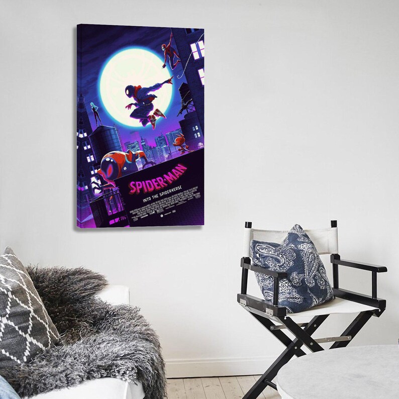 May include: A framed canvas print of the animated film "Spider-Man: Into the Spider-Verse." The artwork features Spider-Man in mid-air against a cityscape backdrop with a large moon. The title of the film is prominently displayed.
