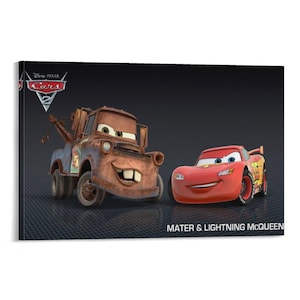 May include: A canvas print featuring two animated cars from the Disney Pixar Cars 2 movie. On the left is Mater, a brown tow truck, and on the right is Lightning McQueen, a red race car. The Cars 2 logo is in the upper left corner, and the text "Mater & Lightning McQueen" is at the bottom.