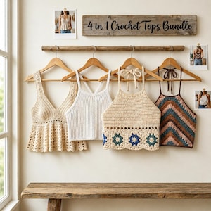 May include: Four crochet tops in various styles hang on wooden hangers. The tops include a cream-colored V-neck, a white ribbed tank, a beige halter top with blue and green floral accents, and a brown and blue chevron pattern top. A wooden sign reads "4 in 1 Crochet Tops Bundle."