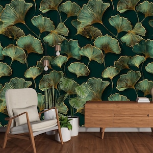 May include: A dark green wallpaper with a repeating pattern of gold-outlined ginkgo leaves. The leaves have a textured appearance and are layered across the surface. A wooden chair, a wooden cabinet, and potted plants are in the foreground.