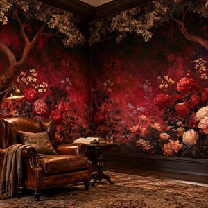 May include: A brown leather armchair with a draped throw blanket and a patterned pillow sits beside a small wooden table with an open book and a glass. The room features dark walls with a mural of large red roses and tree branches.