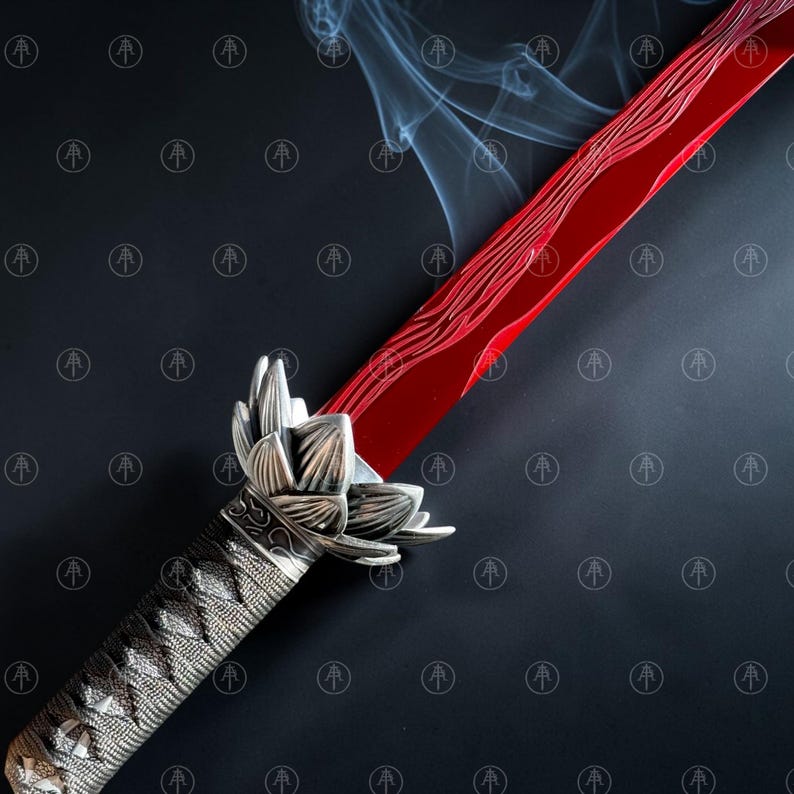 May include: A sword with a vibrant red blade featuring a wavy pattern and a silver-toned hilt designed to resemble a lotus flower. The handle is wrapped in a textured material, and thin wisps of smoke rise from the blade against a dark background.