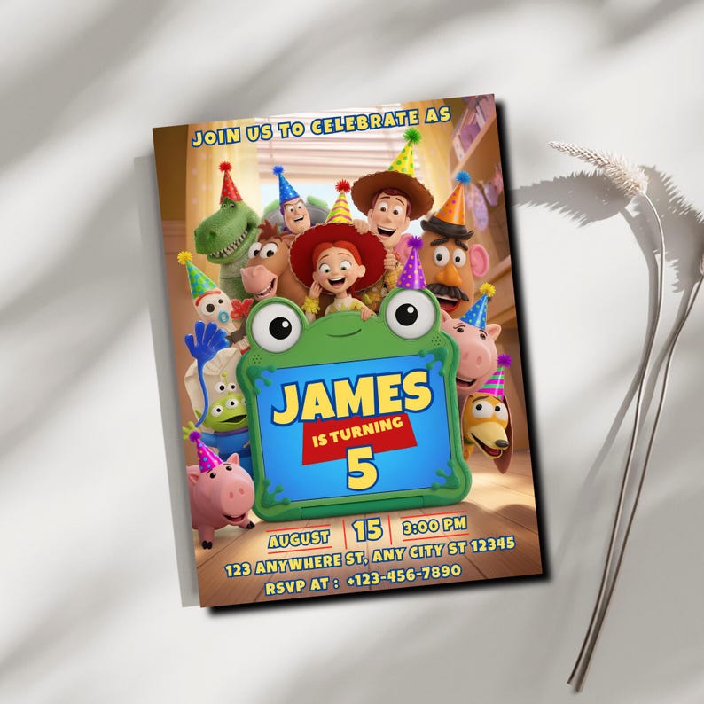 May include: A rectangular birthday invitation card featuring Toy Story characters wearing party hats. A green frog-shaped frame in the center displays the text: JOIN US TO CELEBRATE AS JAMES IS TURNING 5, AUGUST 15, 3:00 PM, 123 ANYWHERE ST, ANY CITY ST 12345, RSVP AT: +123-456-7890.