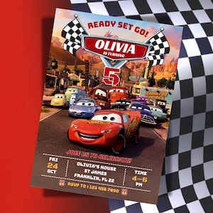 May include: A colorful birthday party invitation featuring the animated movie Cars. The invitation includes the text "Ready Set Go!" and "Olivia is turning 5". The invitation also includes the date, time, and location of the party.