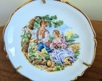 Hombre y mujer del plato 'Boucher' de Limoge