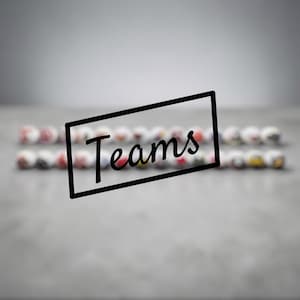 May include: A collection of small, round, white spherical objects arranged in two horizontal rows. Each sphere features a unique, colourful graphic design. A black rectangular frame is superimposed over the centre, containing the word Teams.