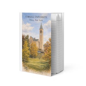 May include: A notebook featuring a watercolour painting of Cornell University's Ithaca, New York campus on the cover. The image shows the university's clock tower and autumn trees. The text "CORNELL UNIVERSITY Ithaca, New York" is printed at the top.