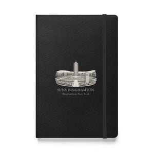 May include: A black hardcover notebook with a vertical elastic closure band. The front cover features a white line-art illustration of the SUNY Binghamton campus, with the text "SUNY BINGHAMTON" and "Binghamton, New York" printed below it.