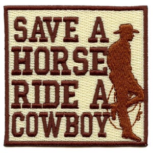 May include: Embroidered patch with the text "SAVE A HORSE RIDE A COWBOY" in brown block letters. A brown silhouette of a cowboy leans against a rope on the right side. The background is a light beige color.