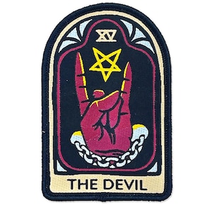 May include: Embroidered patch featuring a red hand making a rock and roll gesture, with a pentagram and chain design. The patch has a black background with a cream border and the text "THE DEVIL".