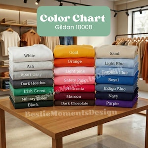 Könnte beinhalten: Eine Farbkarte für Gildan 18000-Kleidung mit Stapeln gefalteter Sweatshirts in verschiedenen Farben. Zu den Farben gehören Weiß, Aschgrau, Sportgrau, Dunkelgrau und mehr. Der Text "Color Chart" und "Gildan 18000" sind zu sehen.